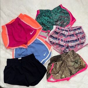 6 pairs girls play shorts. 4 are Nike